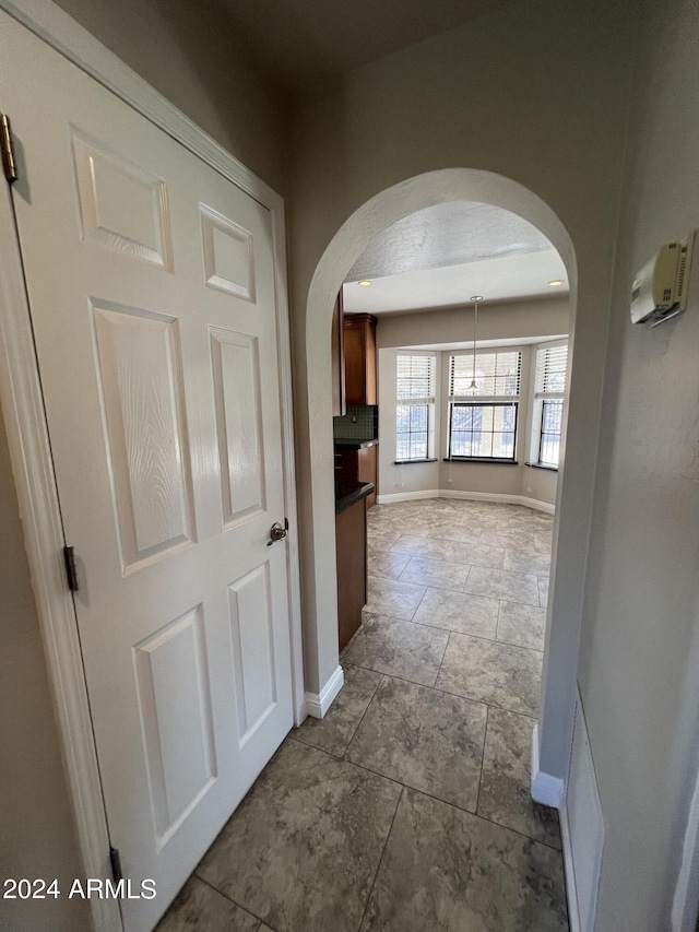 15230 N Blackbird Dr, Fountain Hills, AZ 85268 - corridor with arched walkways and baseboards