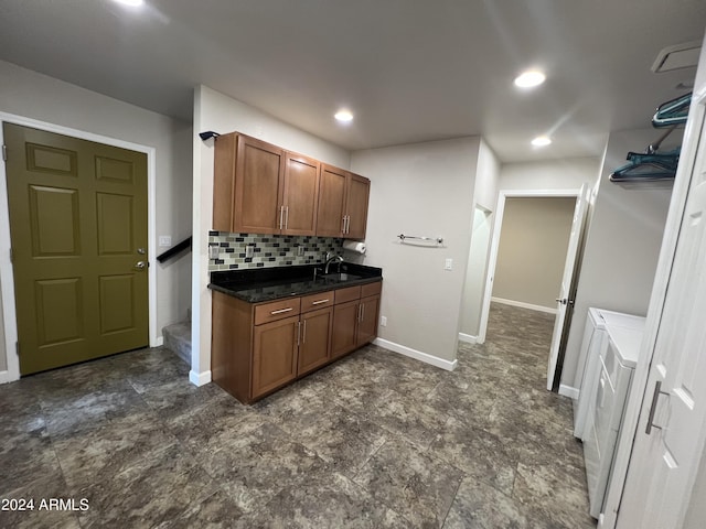 15230 N Blackbird Dr, Fountain Hills, AZ 85268 - kitchen featuring a sink, dark countertops, tasteful backsplash, brown cabinets, and baseboards