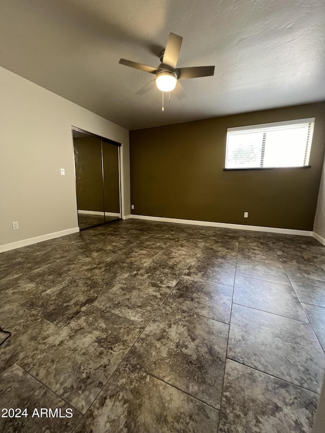 15230 N Blackbird Dr, Fountain Hills, AZ 85268 - unfurnished bedroom with a closet, baseboards, and a ceiling fan