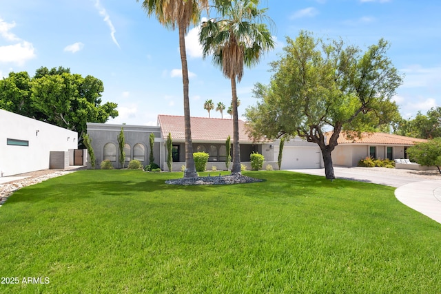 8007 E Del Tesoro Dr, Scottsdale, AZ 85258 - view of front facade with a tiled roof, concrete driveway, a front lawn, and stucco siding