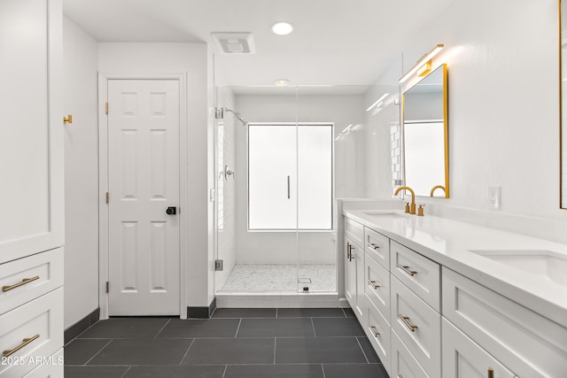 8007 E Del Tesoro Dr, Scottsdale, AZ 85258 - bathroom with double vanity, a shower stall, tile patterned flooring, and recessed lighting