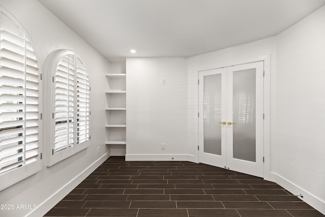 8007 E Del Tesoro Dr, Scottsdale, AZ 85258 - unfurnished room with wood tiled floors, recessed lighting, and french doors
