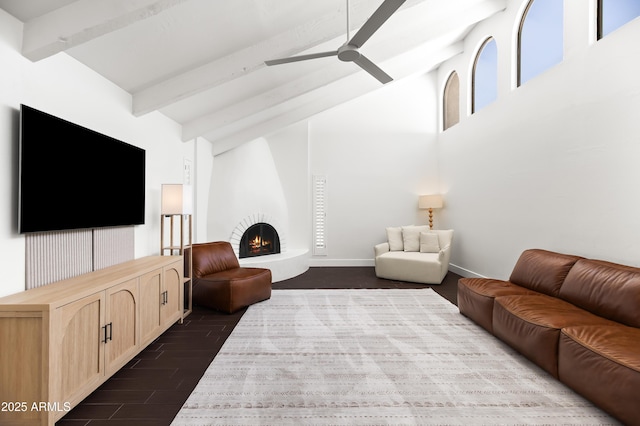 8007 E Del Tesoro Dr, Scottsdale, AZ 85258 - living room featuring beamed ceiling, dark wood finished floors, a ceiling fan, a fireplace, and high vaulted ceiling