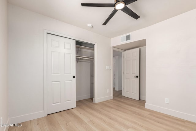 2348 E Diamond Ave, Mesa, AZ 85204 - unfurnished bedroom with baseboards, light wood-type flooring, a closet, and ceiling fan