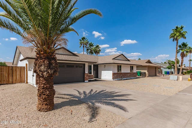 2348 E Diamond Ave, Mesa, AZ 85204 - ranch-style house featuring a garage, driveway, roof with shingles, brick siding, and stucco siding