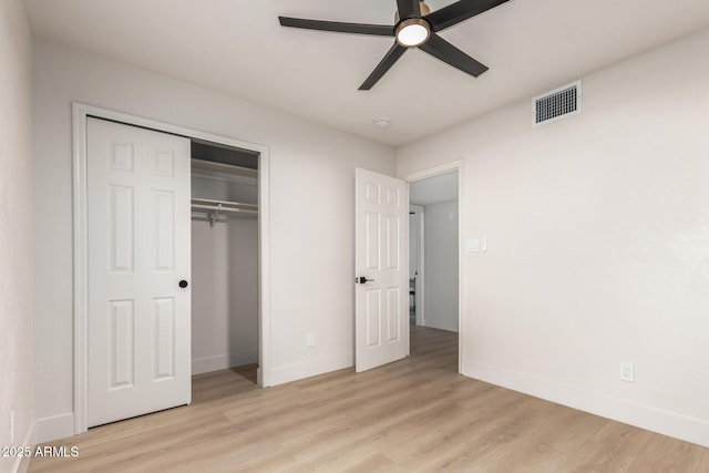 2348 E Diamond Ave, Mesa, AZ 85204 - unfurnished bedroom featuring baseboards, light wood finished floors, a closet, and ceiling fan