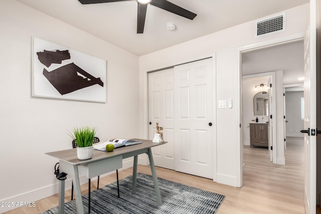 2348 E Diamond Ave, Mesa, AZ 85204 - home office with baseboards, a ceiling fan, and light wood-style floors