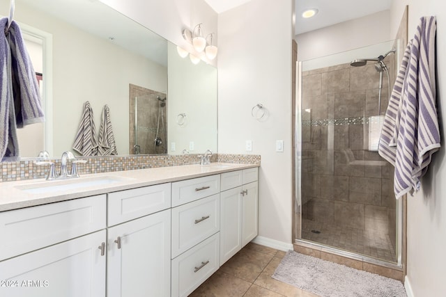 bathroom with vanity, backsplash, tile patterned floors, and a shower with shower door