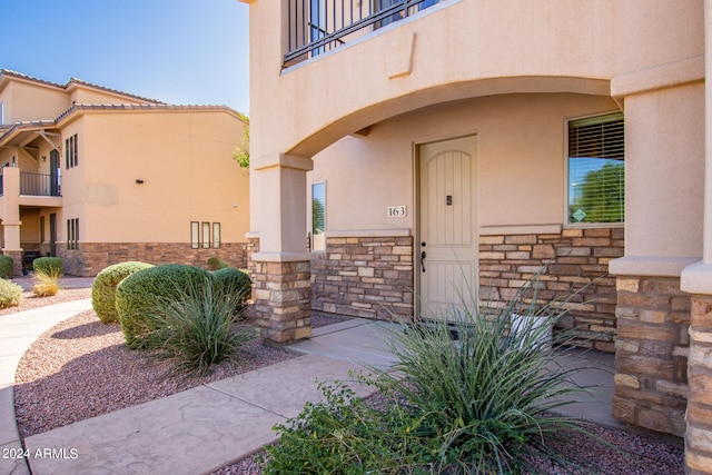 doorway to property with a balcony