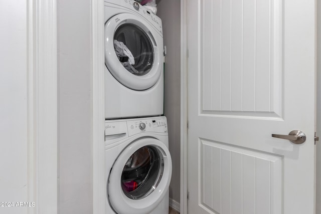 laundry room with stacked washer and clothes dryer