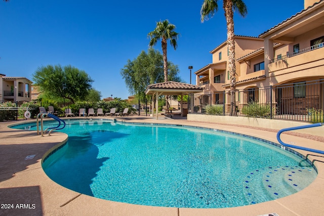 view of pool featuring a gazebo and a patio area