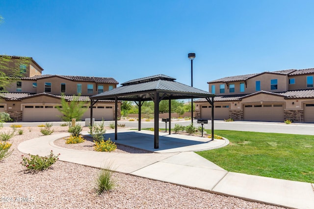 exterior space featuring a gazebo and a lawn