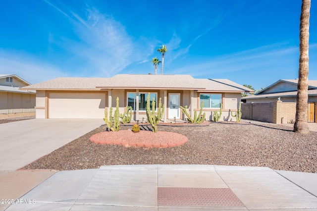 ranch-style house featuring a garage