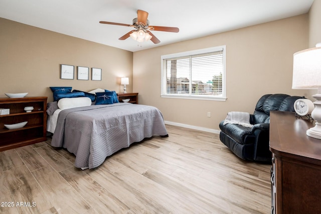 bedroom featuring light hardwood / wood-style floors and ceiling fan