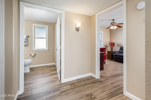 hall with light wood-type flooring