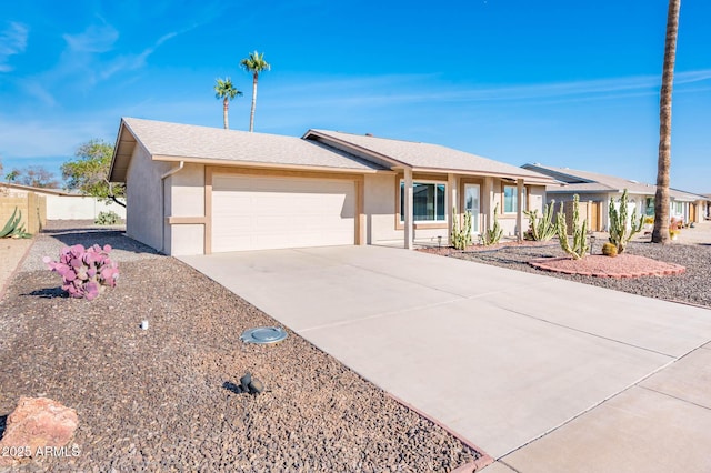 ranch-style home featuring a garage