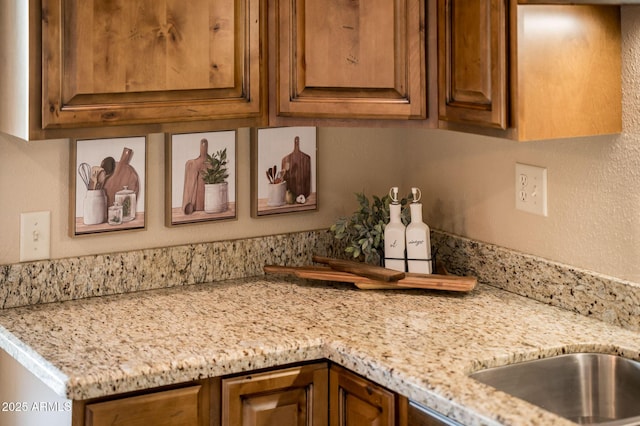 kitchen featuring light stone counters