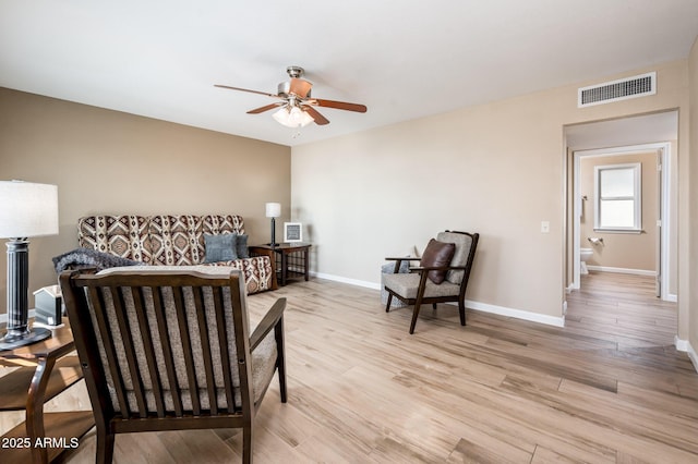 bedroom with ceiling fan and light hardwood / wood-style floors