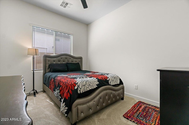 bedroom featuring ceiling fan, vaulted ceiling, and light colored carpet