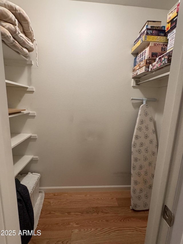 spacious closet featuring wood finished floors