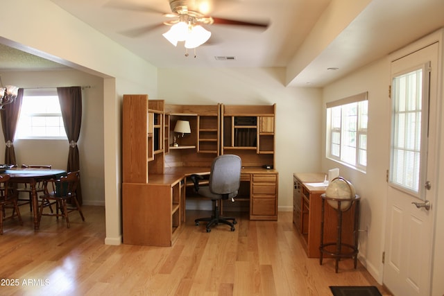 office with a ceiling fan, light wood-type flooring, visible vents, and baseboards