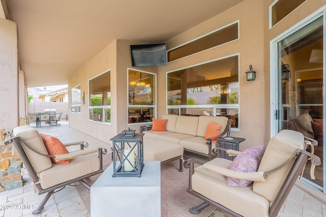 view of patio / terrace featuring outdoor dining space, outdoor lounge area, and fence