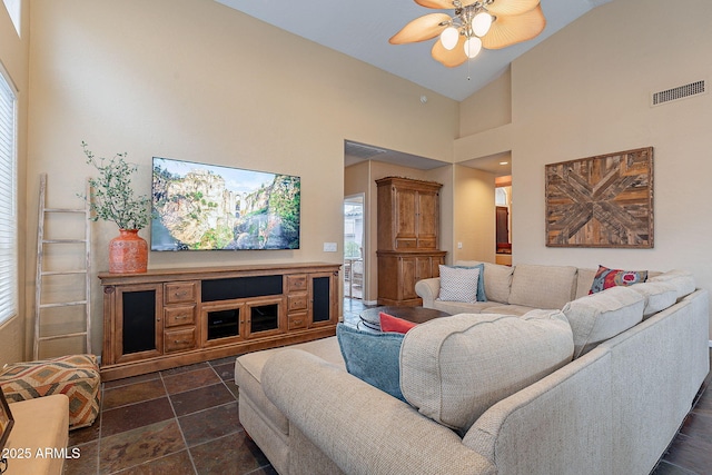 living room with visible vents, high vaulted ceiling, and a ceiling fan