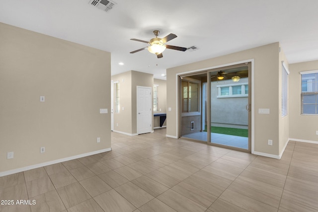 empty room with a ceiling fan, recessed lighting, visible vents, and baseboards