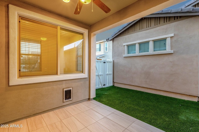 exterior space featuring ceiling fan