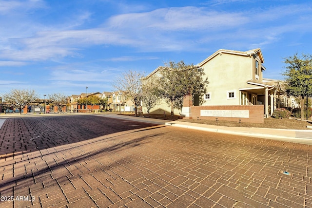 view of road with curbs and sidewalks