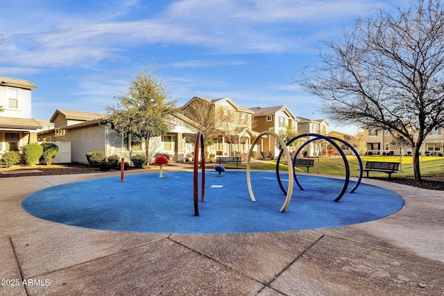 community jungle gym with a residential view