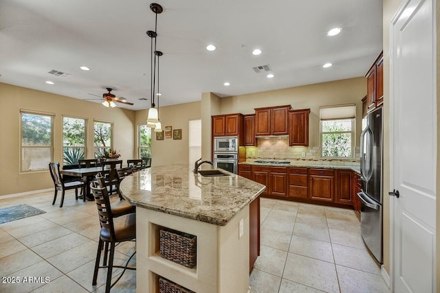 12903 W Brookhart Way, Peoria, AZ 85383 - kitchen featuring stainless steel appliances, a sink, light tile patterned floors, decorative backsplash, and recessed lighting
