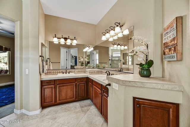 12903 W Brookhart Way, Peoria, AZ 85383 - full bath featuring double vanity, tile patterned floors, a chandelier, and high vaulted ceiling