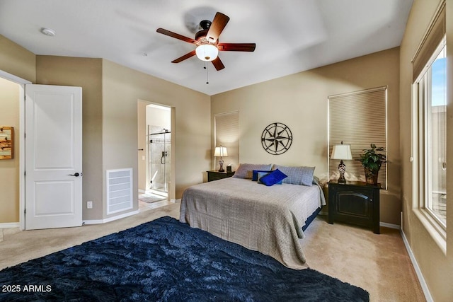 12903 W Brookhart Way, Peoria, AZ 85383 - carpeted bedroom featuring baseboards, ensuite bathroom, and ceiling fan