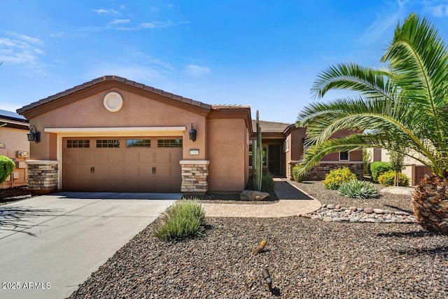12903 W Brookhart Way, Peoria, AZ 85383 - view of front facade featuring driveway, a garage, stucco siding, and stone siding