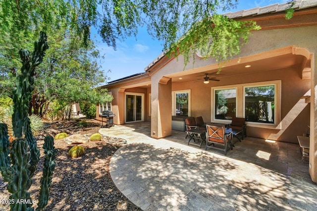 12903 W Brookhart Way, Peoria, AZ 85383 - back of house with ceiling fan, stucco siding, and a patio area