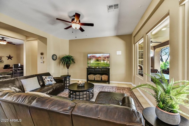 12903 W Brookhart Way, Peoria, AZ 85383 - living room featuring a ceiling fan, baseboards, and tile patterned floors