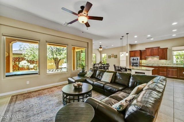 12903 W Brookhart Way, Peoria, AZ 85383 - living room with ceiling fan, recessed lighting, and baseboards