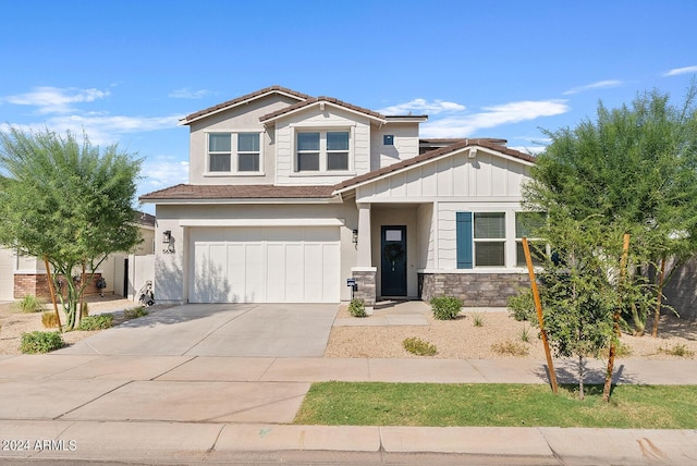 5650 S Feliz, Mesa, AZ 85212 - craftsman-style house with driveway, an attached garage, stone siding, and board and batten siding