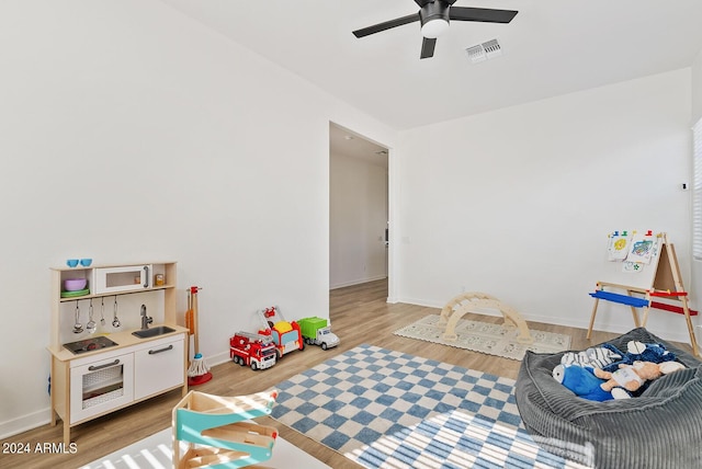 5650 S Feliz, Mesa, AZ 85212 - playroom featuring light wood finished floors and a ceiling fan
