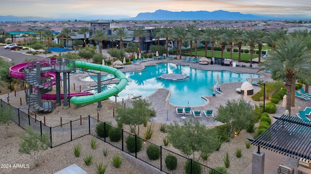 5650 S Feliz, Mesa, AZ 85212 - community pool featuring a water slide, a mountain view, and a patio