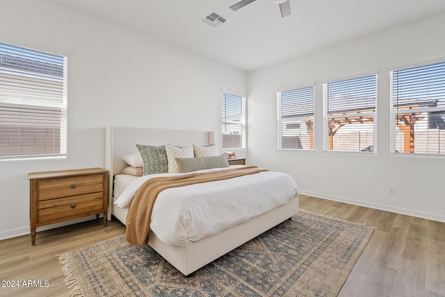 5650 S Feliz, Mesa, AZ 85212 - bedroom with light wood-style floors and a ceiling fan