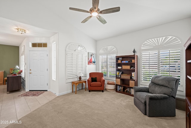 2243 E Cortez Dr, Gilbert, AZ 85234 - living area featuring vaulted ceiling, ceiling fan, carpet flooring, tile patterned flooring, and baseboards