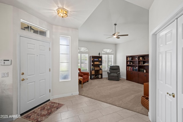 2243 E Cortez Dr, Gilbert, AZ 85234 - entrance foyer with light carpet, a ceiling fan, baseboards, lofted ceiling, and light tile patterned floors