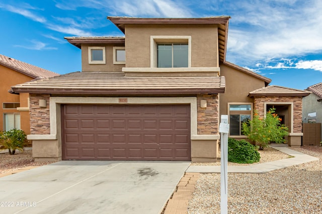 view of front of property with a garage