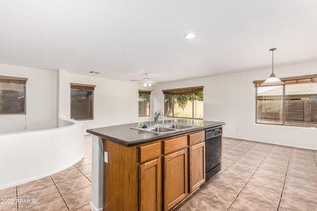 kitchen with black dishwasher, a kitchen island with sink, sink, decorative light fixtures, and ceiling fan