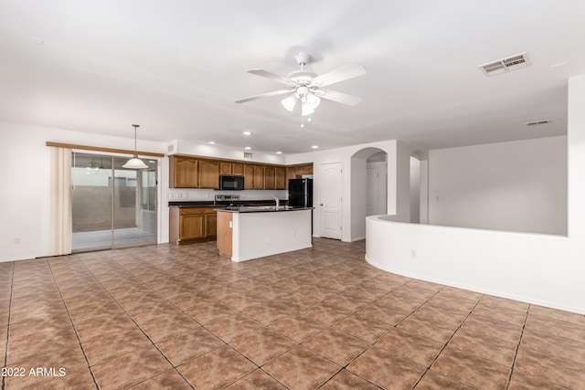 kitchen with a center island, sink, black appliances, decorative light fixtures, and ceiling fan