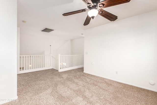 unfurnished room featuring ceiling fan and light carpet