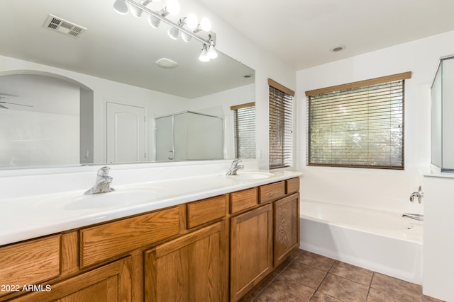 bathroom with ceiling fan, vanity, tile patterned flooring, and separate shower and tub