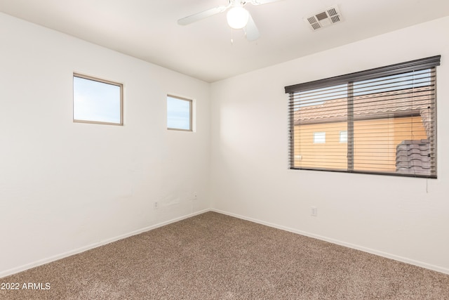 carpeted empty room with ceiling fan